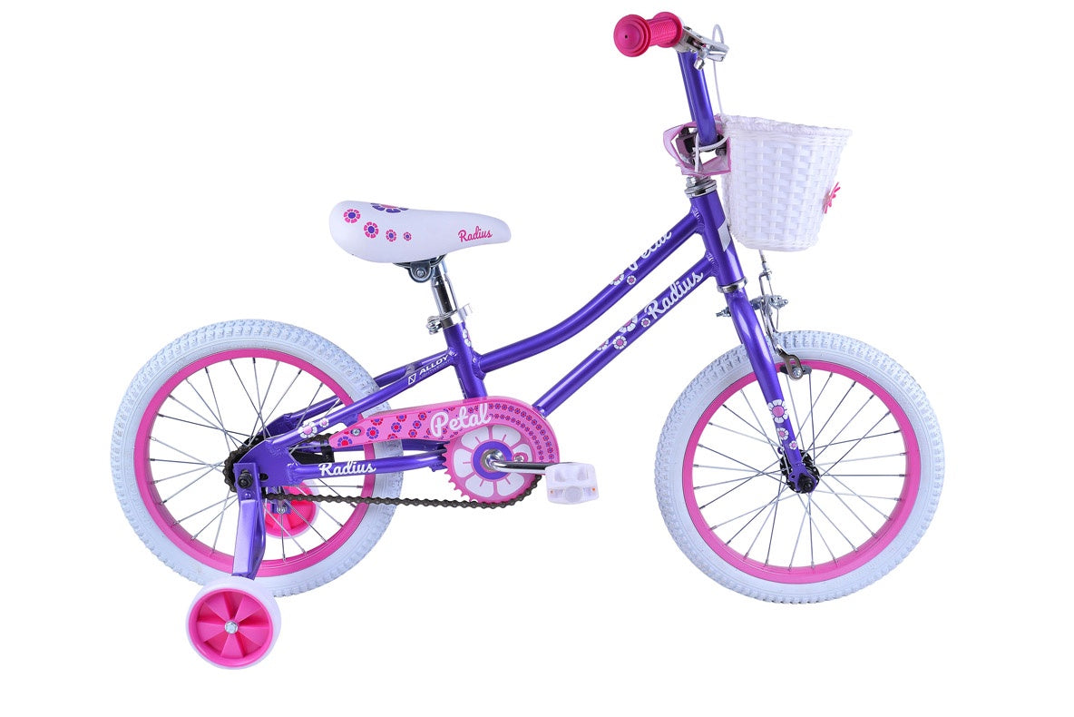 Kids bicycle with purple frame, front basket, pink wheels and handlebar pad.
