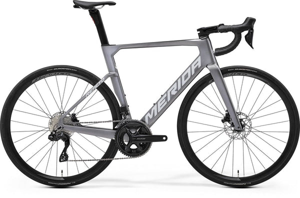 MERIDA REACTO 6000 road bike, gunmetal grey frame, drop handlebars, disc wheels