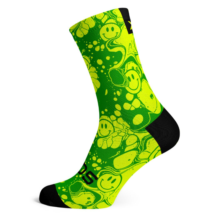 Neon yellow crew socks with green smiley pattern and black toe and heel