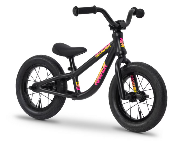 Black 12-inch BMX bike with padded seat and colorful frame decals