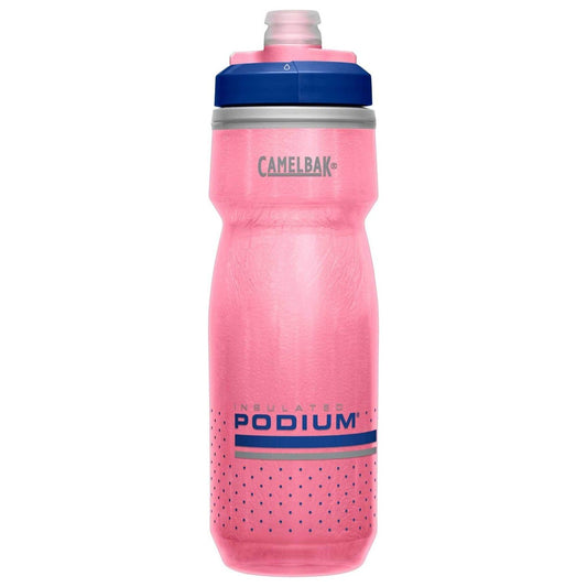 a pink bottle sitting on top of a table 